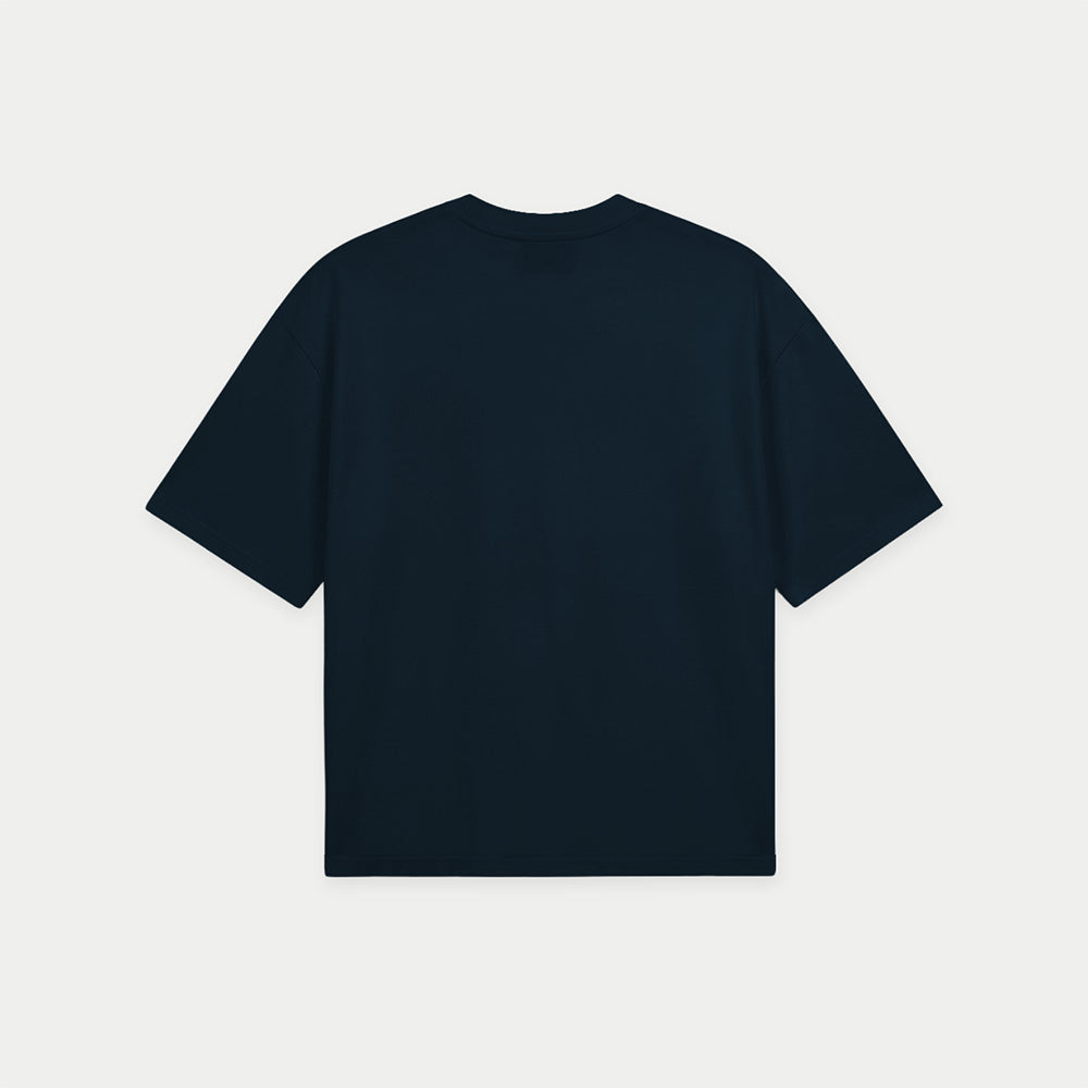 Navy blue oversized boxy t-shirt back view with elegant “Niche” script logo in white centered on the chest – Caracas Merch