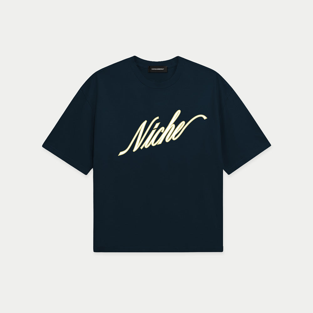 Navy blue oversized boxy t-shirt front view with elegant “Niche” script logo in white centered on the chest – Caracas Merch