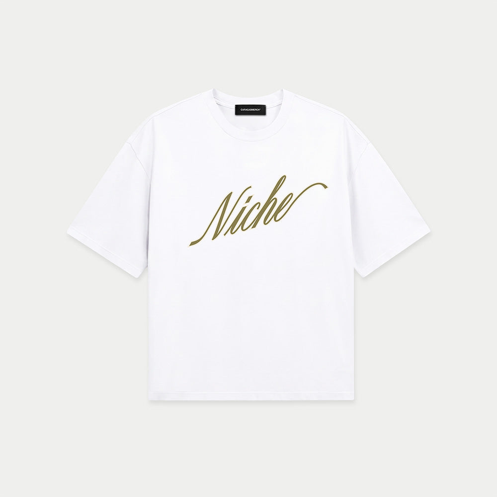 White oversized boxy t-shirt front view with elegant “Niche” script logo in gold centered on the chest – Caracas Merch