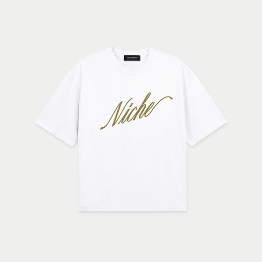 White oversized boxy t-shirt front view with elegant “Niche” script logo in gold centered on the chest – Caracas Merch