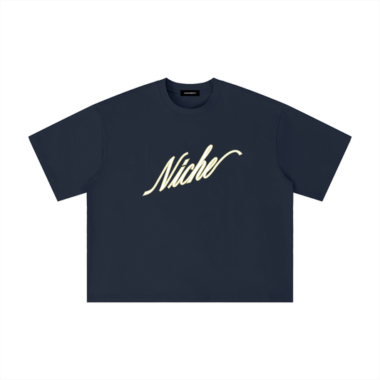 Navy blue oversized boxy t-shirt front view with elegant “Niche” script logo in white centered on the chest – Caracas Merch