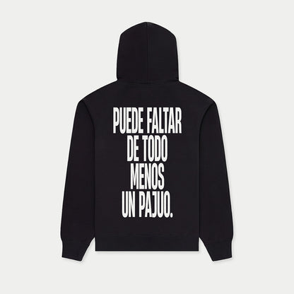 Black hoodie with “Puede faltar de todo menos un pajuo” graphic on back by Caracas Merch