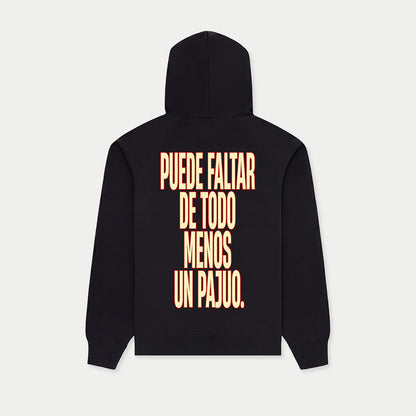 Back view of black hoodie with “Puede faltar de todo menos un Pajuo” print