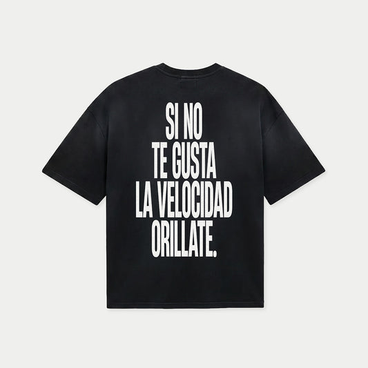 Back view of si no te gusta la velocidad orillate black graphic t-shirt
