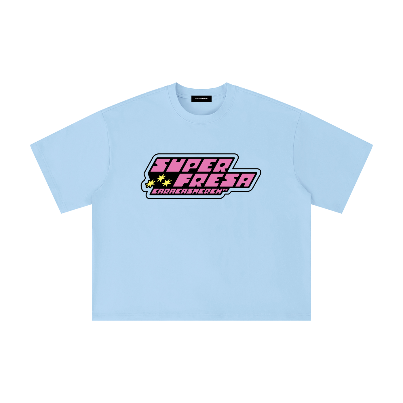 Light blue oversized t-shirt front view with bold “Super Fresa” graphic in pink and black with stars and Caracas Merch branding