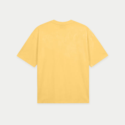 Yellow oversized t-shirt back view with wooden spinning top graphic forming “ccs” in rope-style lettering – Caracas Merch