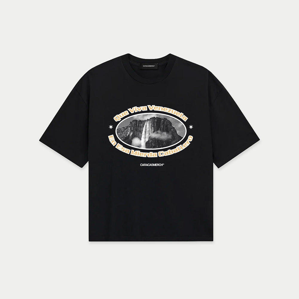 Black boxy t-shirt front view with oval graphic featuring Angel Falls image and “Que viva Venezuela en esa mierda caballero” text – Caracas Merch